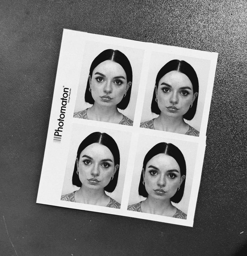 a blurry photo of a person standing in front of a wall