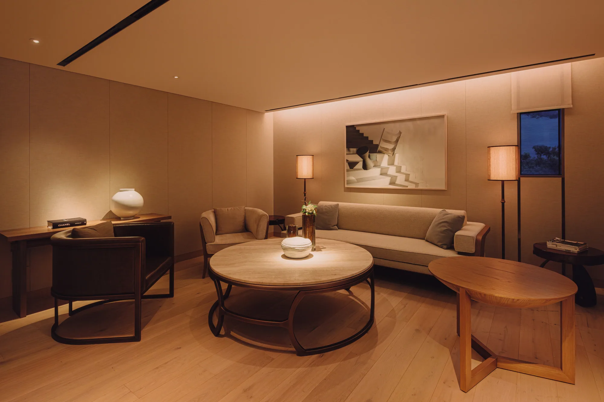 The third-floor PLAYA Lounge, with a sofa and a round table