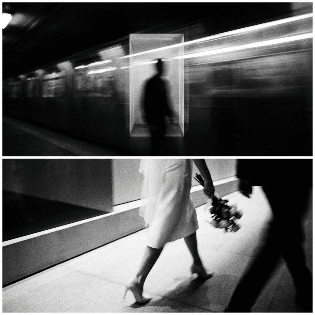 Hand holding an open book beside a laptop and coffee cup.