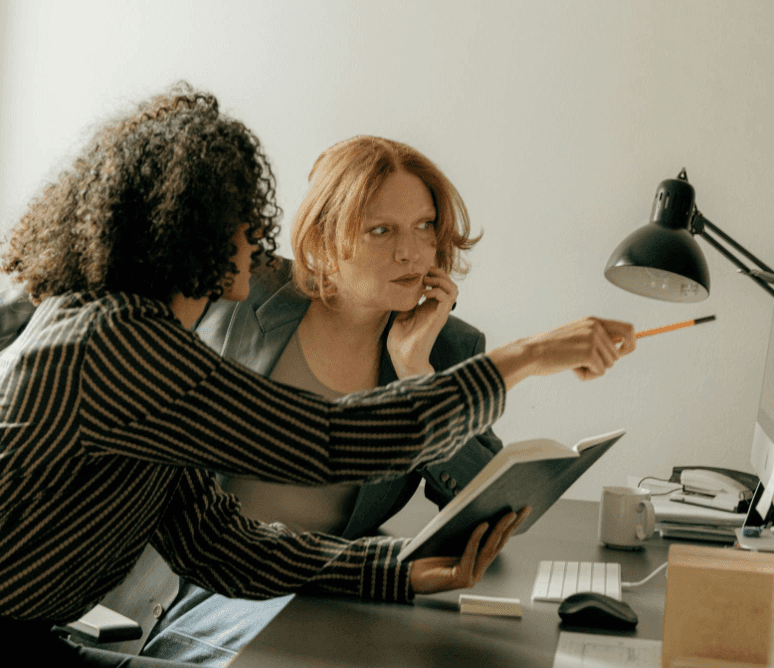 two people looking at a computer screen