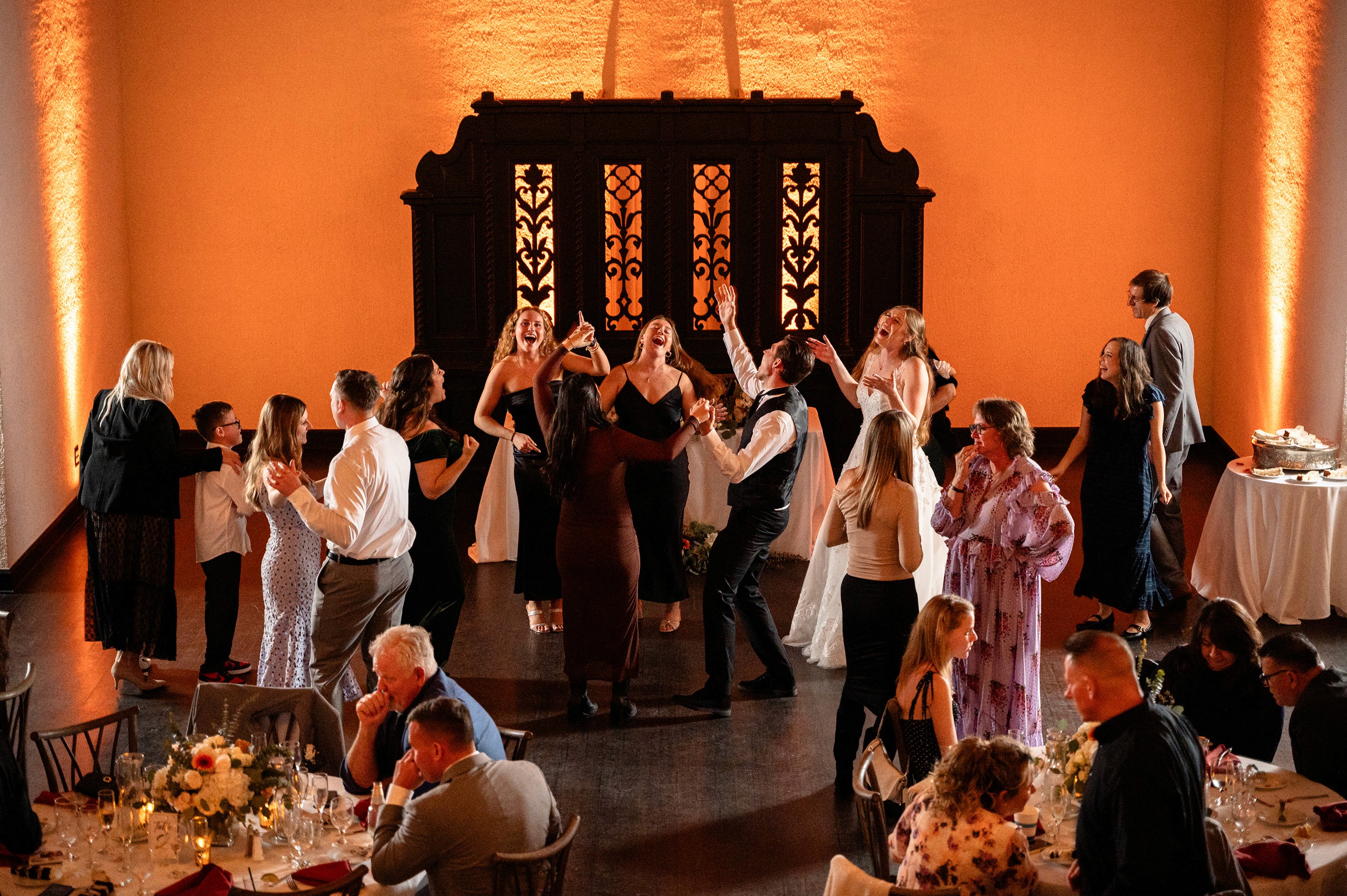 Flat lay wedding details with bouquet, rings, and sparkling bridal heels