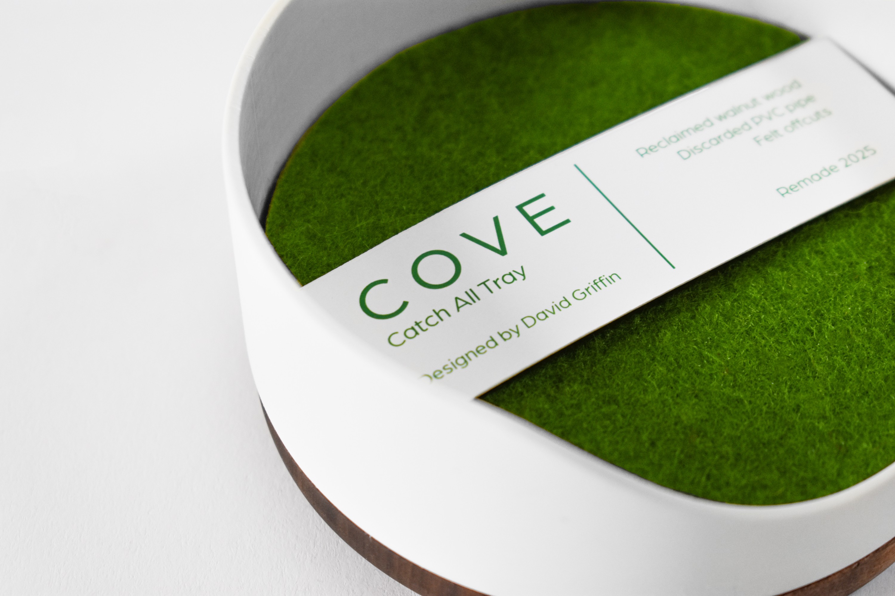Green product packaging arranged in a graphic composition.