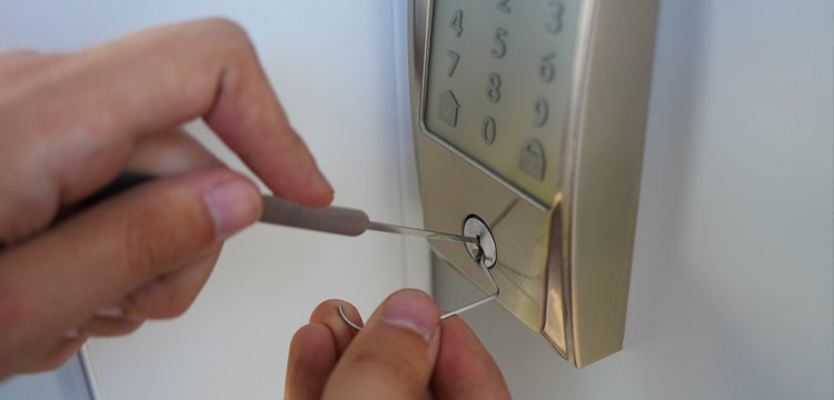 locksmith trying to pick a lock open