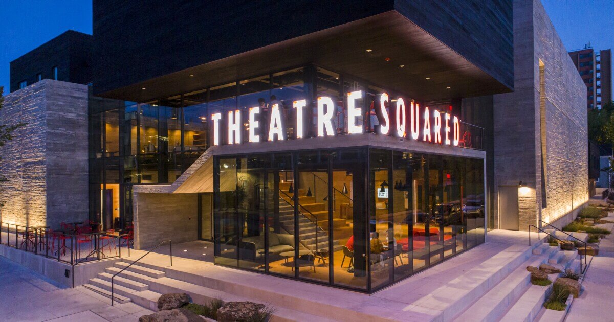 planters with plant near area rug inside room