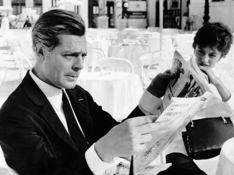 husband and wife working happily on a laptop