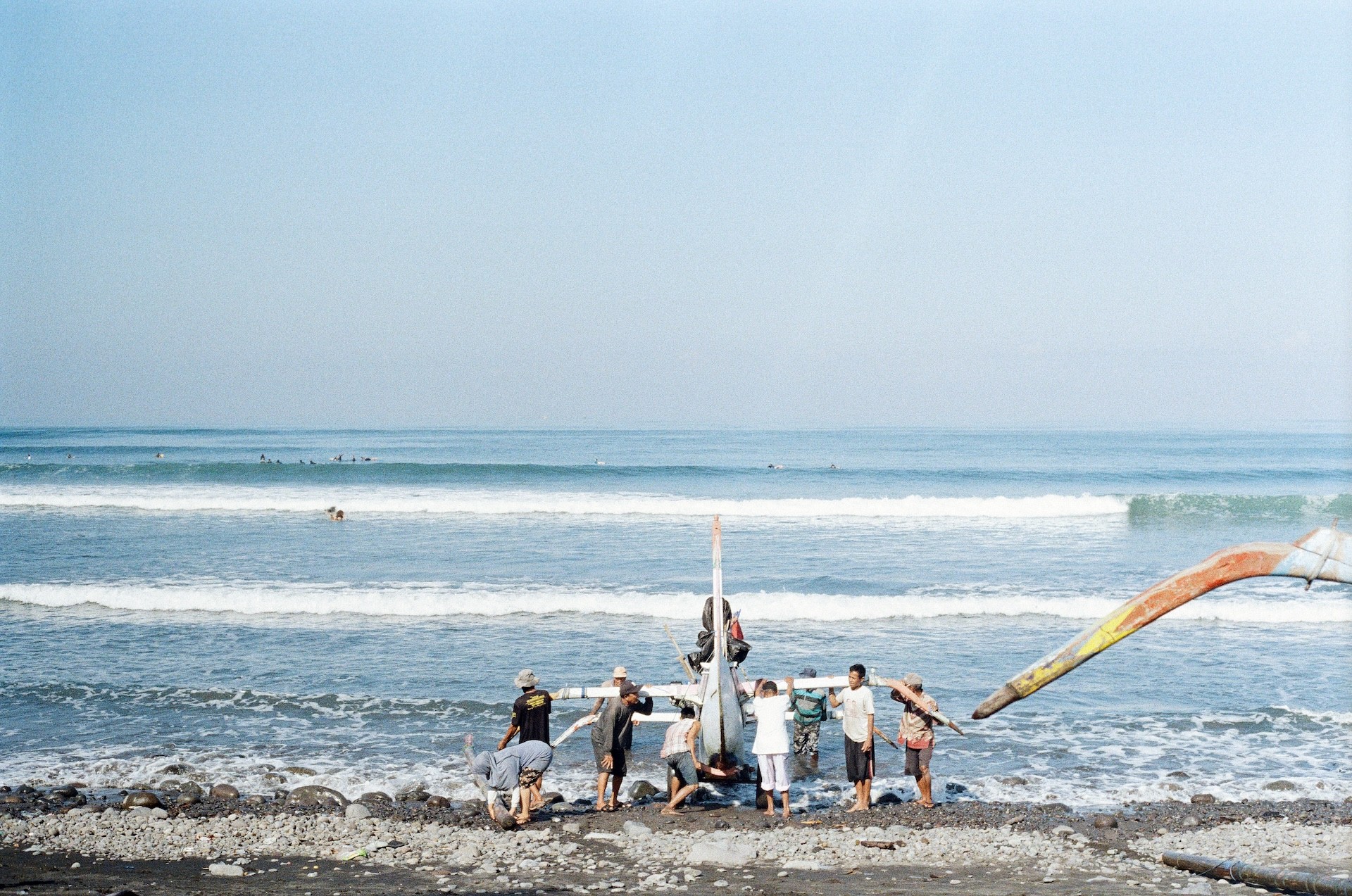 Film Photo of Local People Pushing Boat into Ocean | Traditional Fishing Life in Bali