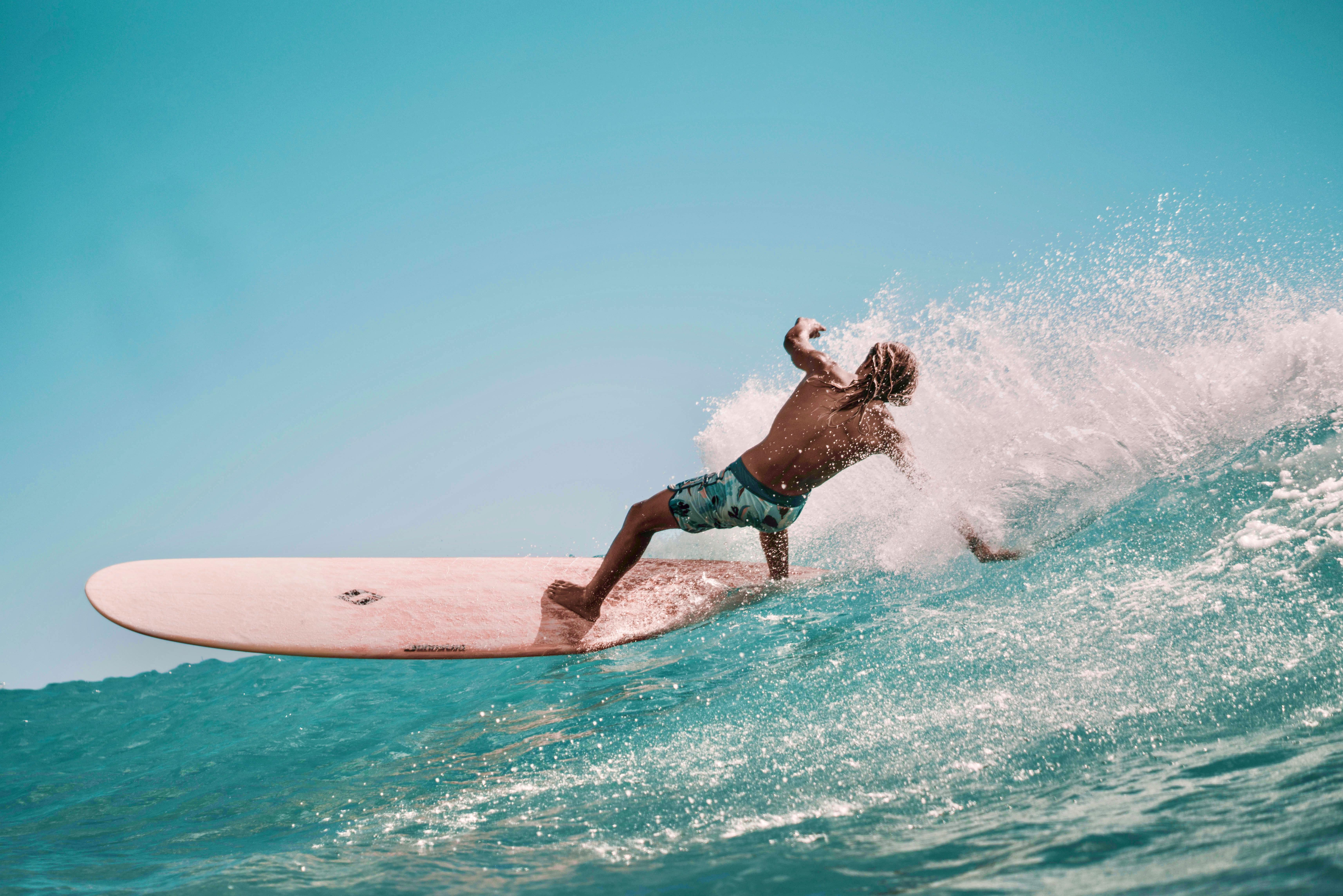 Surfer riding a green wave in Tarifa, Spain – learn to surf with Explora Watersports, a Tarifa surfing experience