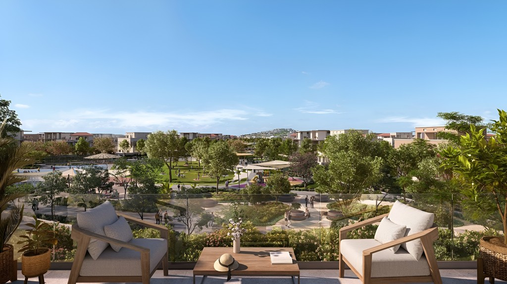 Balcony view showcasing the park and cityscape at Wadeem by Modon.