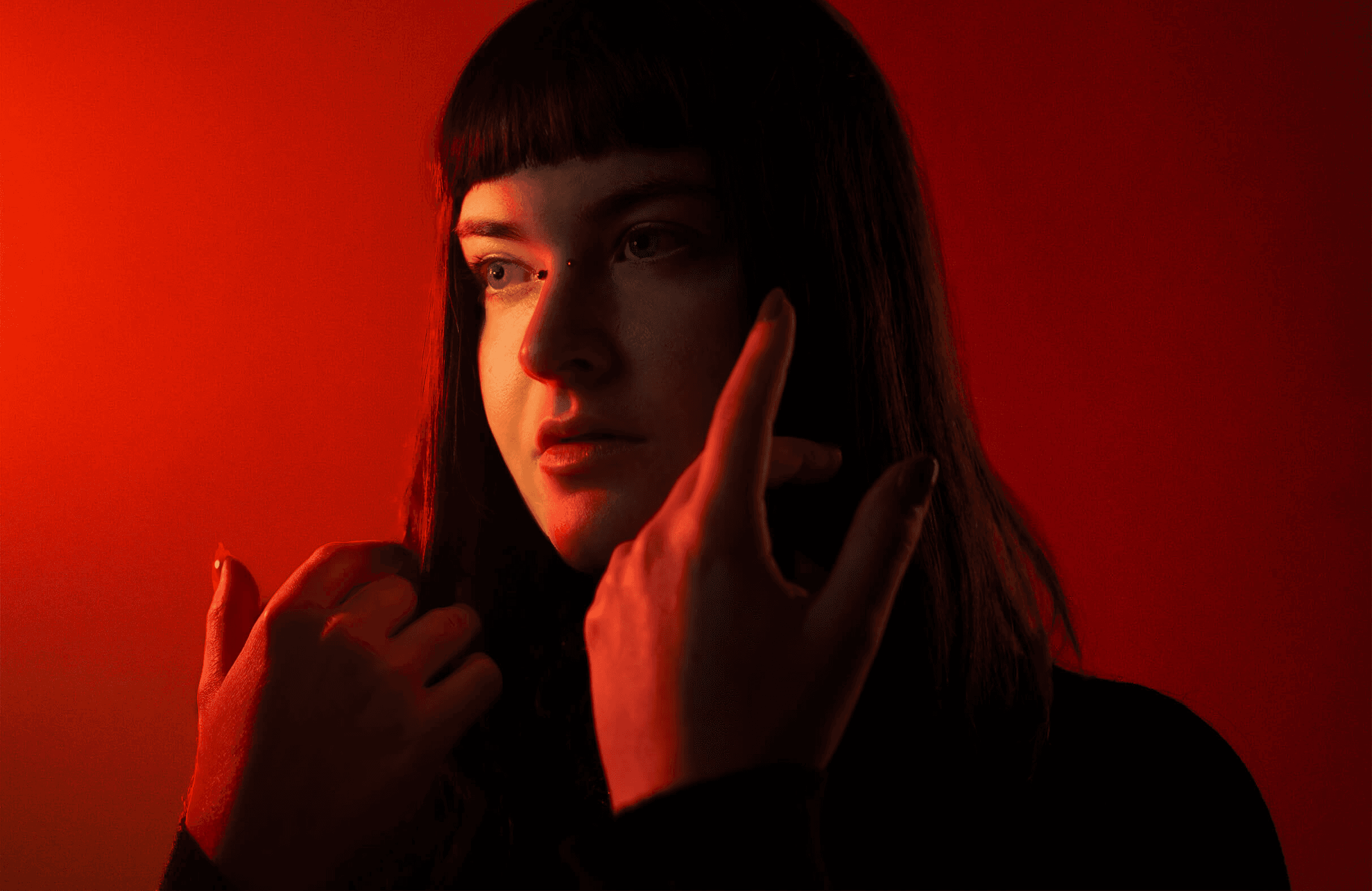 Women in front of an orange background