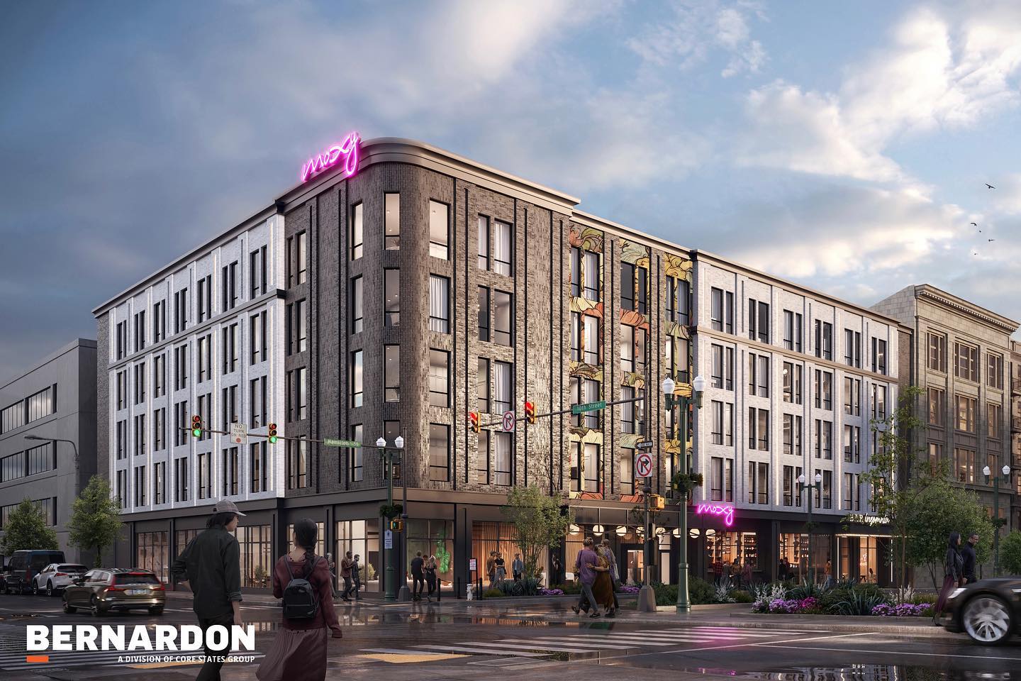 Architectural rendering of a modern mixed-use urban building with pink neon "moxy" signage. The five-story structure features varied facade materials including brick and stone, with ground-floor retail space and large windows throughout. Street scene includes pedestrians, landscaping, and traffic signals at dusk. Bernardon company logo appears in bottom left corner.