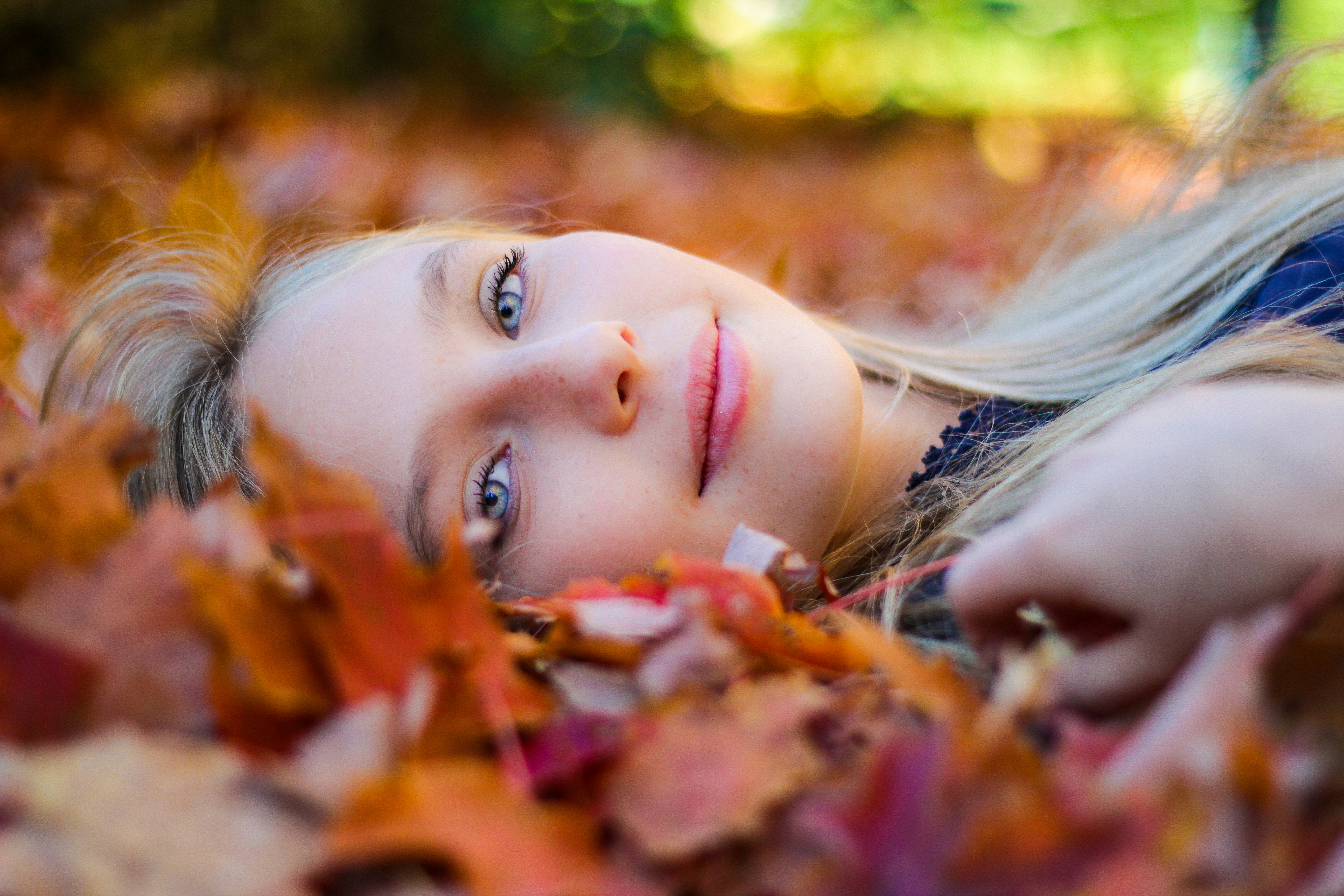 woman sitting in a forest - seasonal color analysis