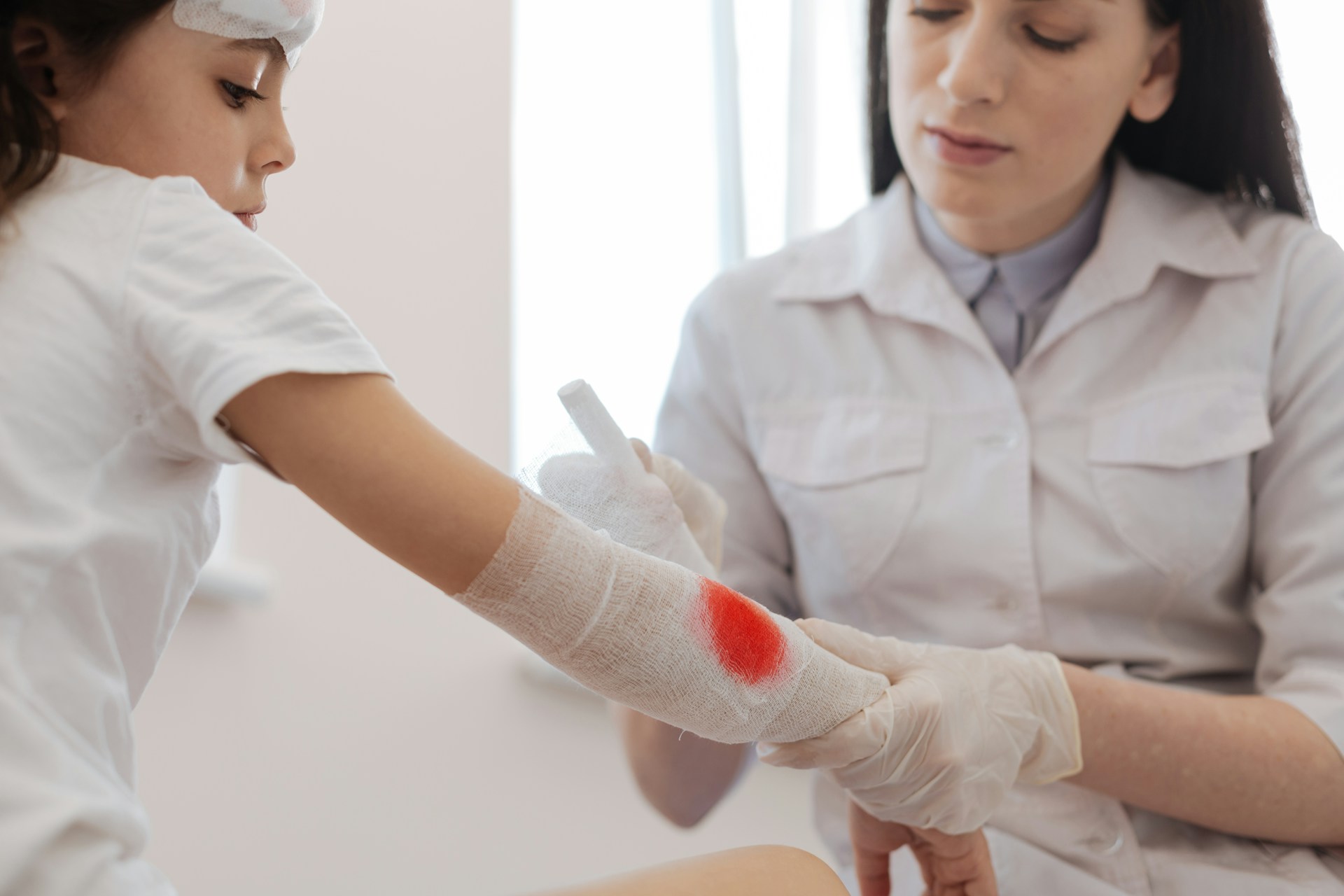 doctor attending to a child's wound