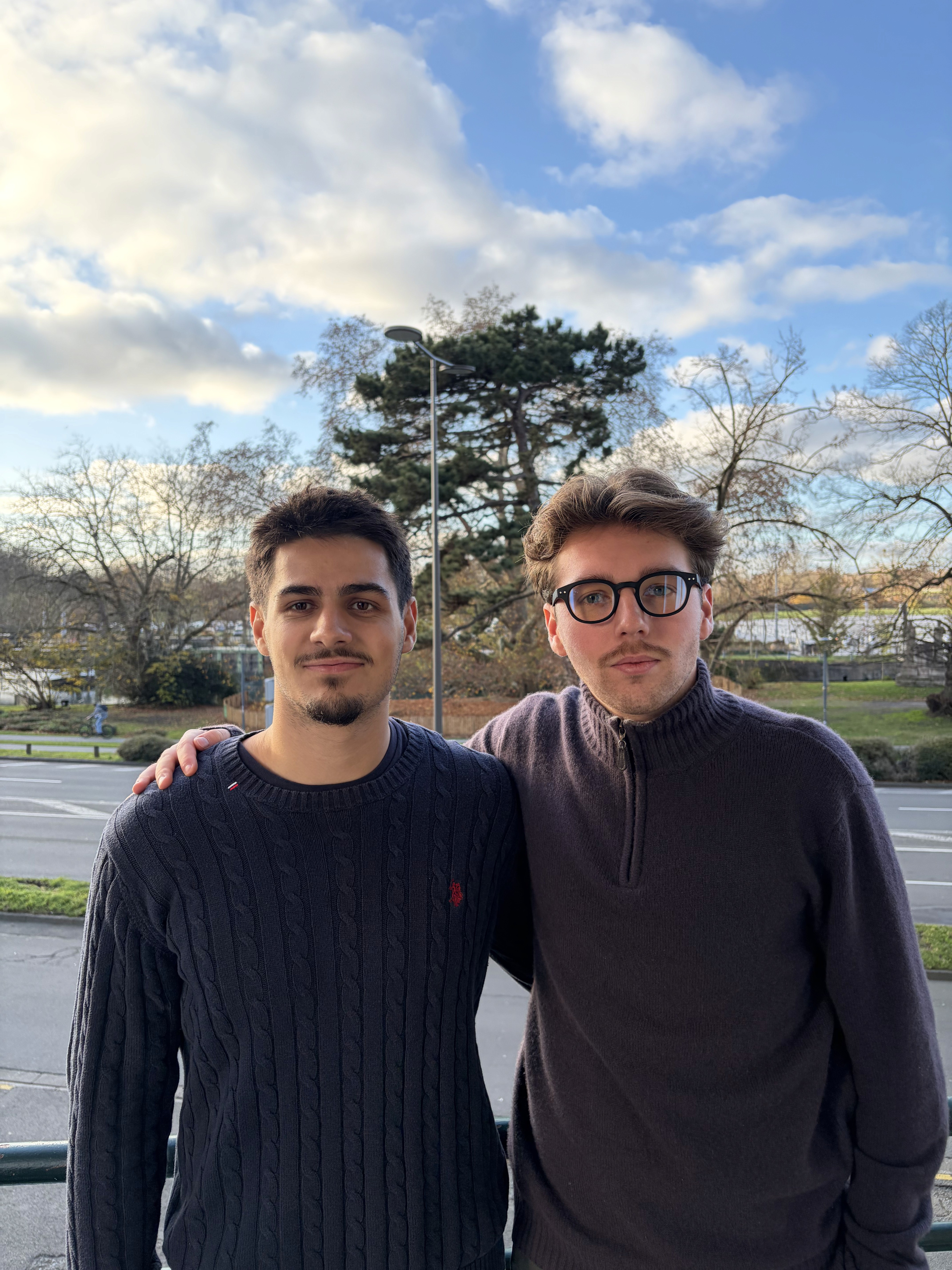 man in white dress shirt sitting beside woman in black long sleeve shirt