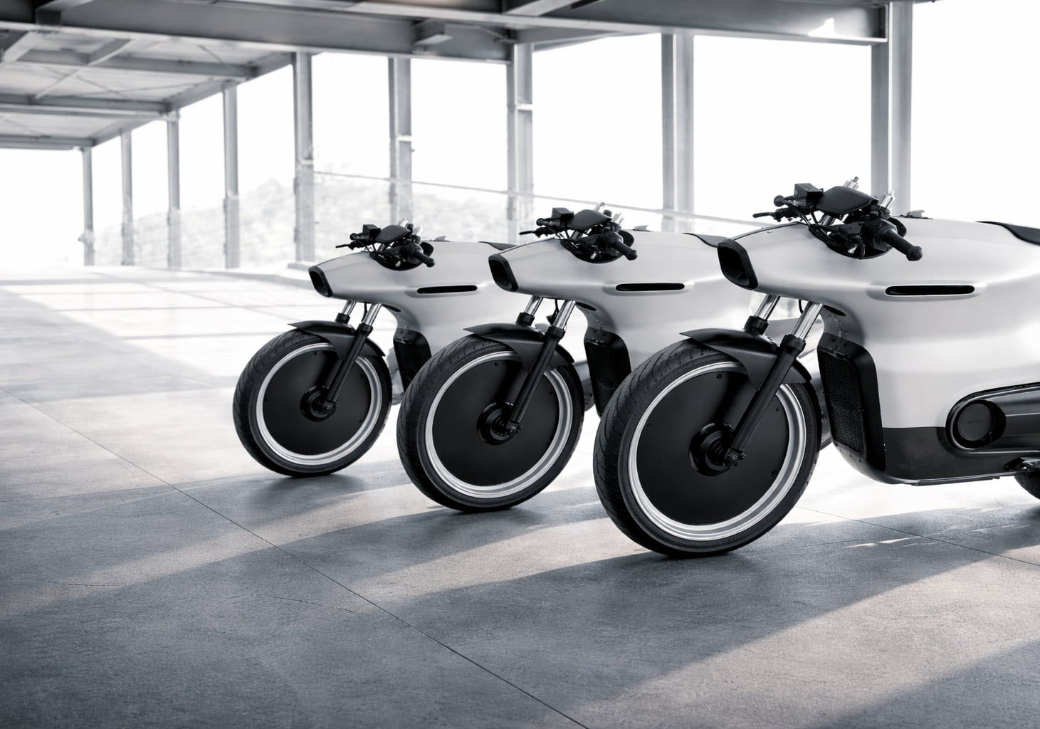 Two MOMO movie bikes in a night-time film scene on a rooftop, showcasing innovative lighting design and silhouettes.