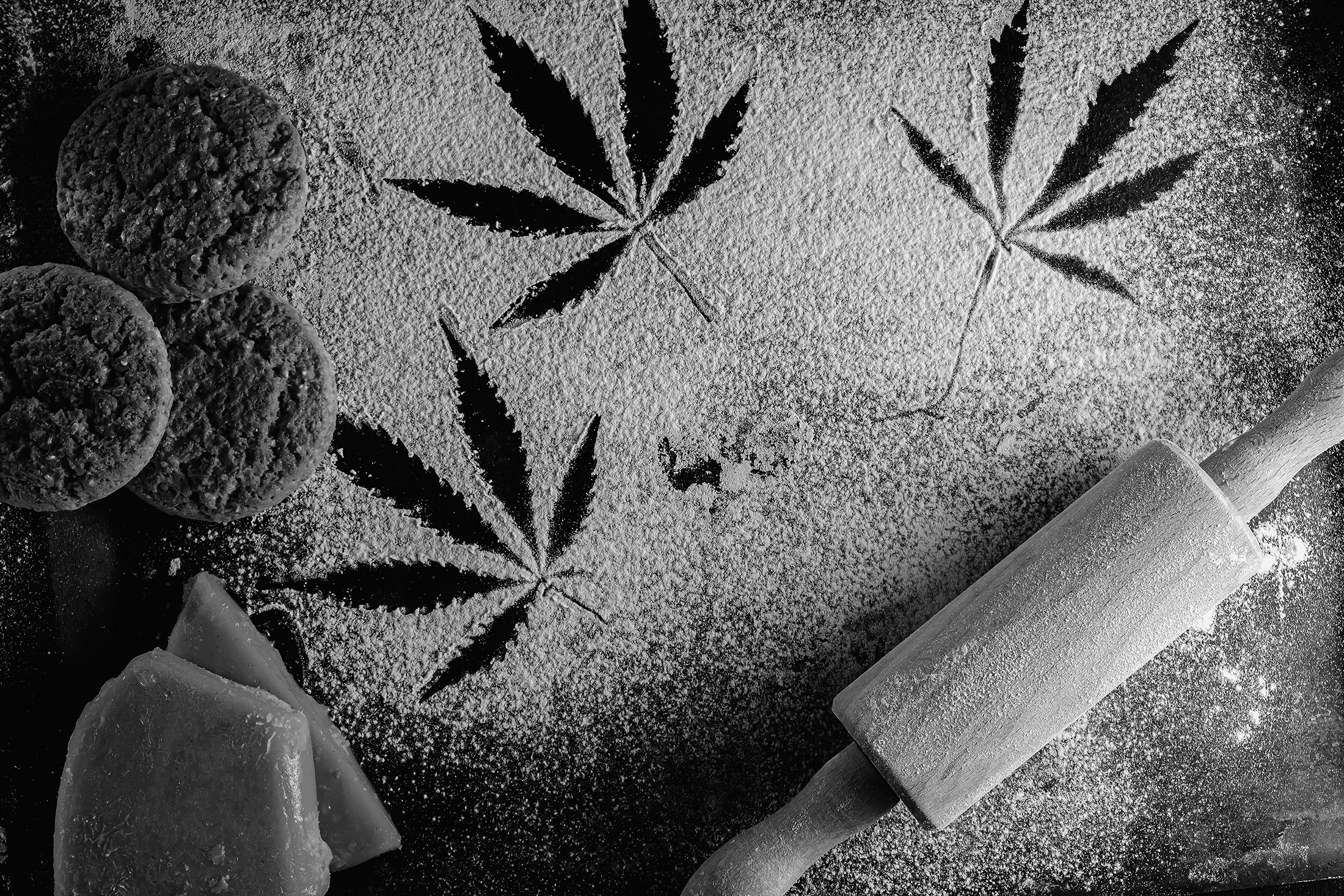 Cannabis leaves imprint on baking flour with cookies