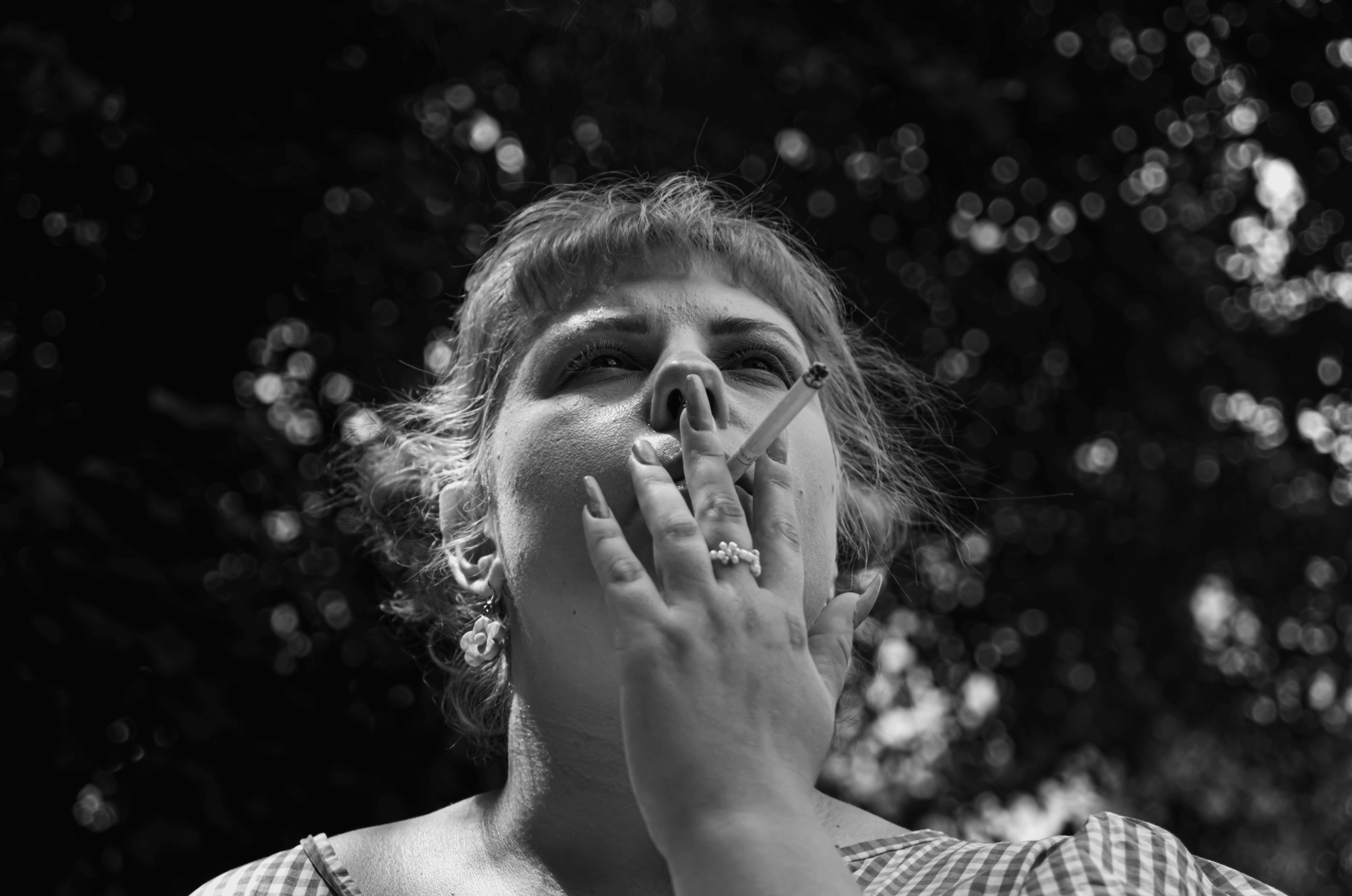 Person sitting on a ledge overlooking New York City skyline