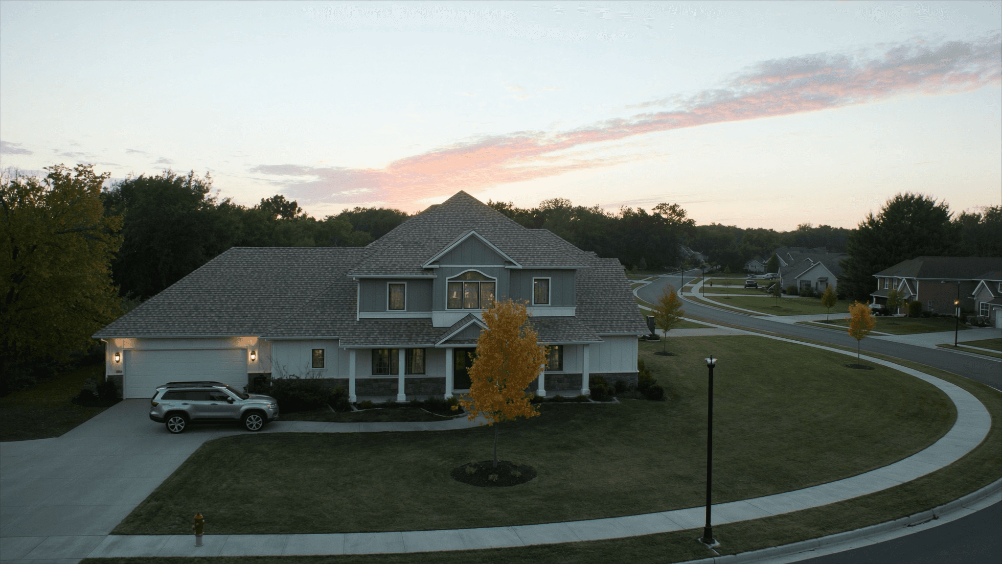 Aerial dawn view of a newly built Northwest Indiana suburban home in a developing community