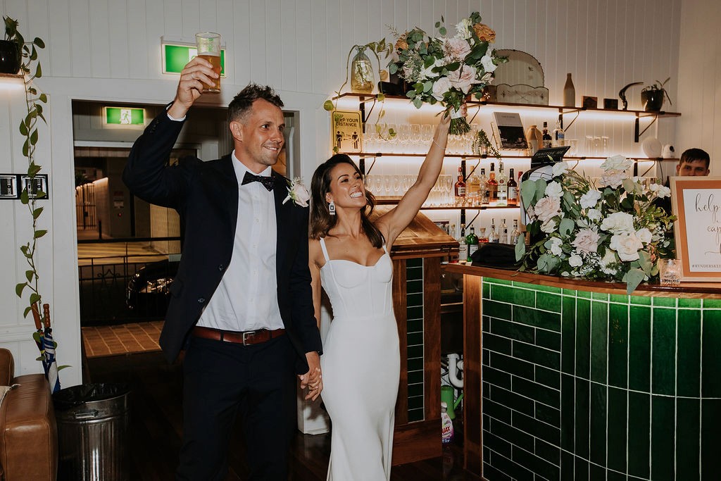 Bride & Groom walking into their reception at Loyal Hope