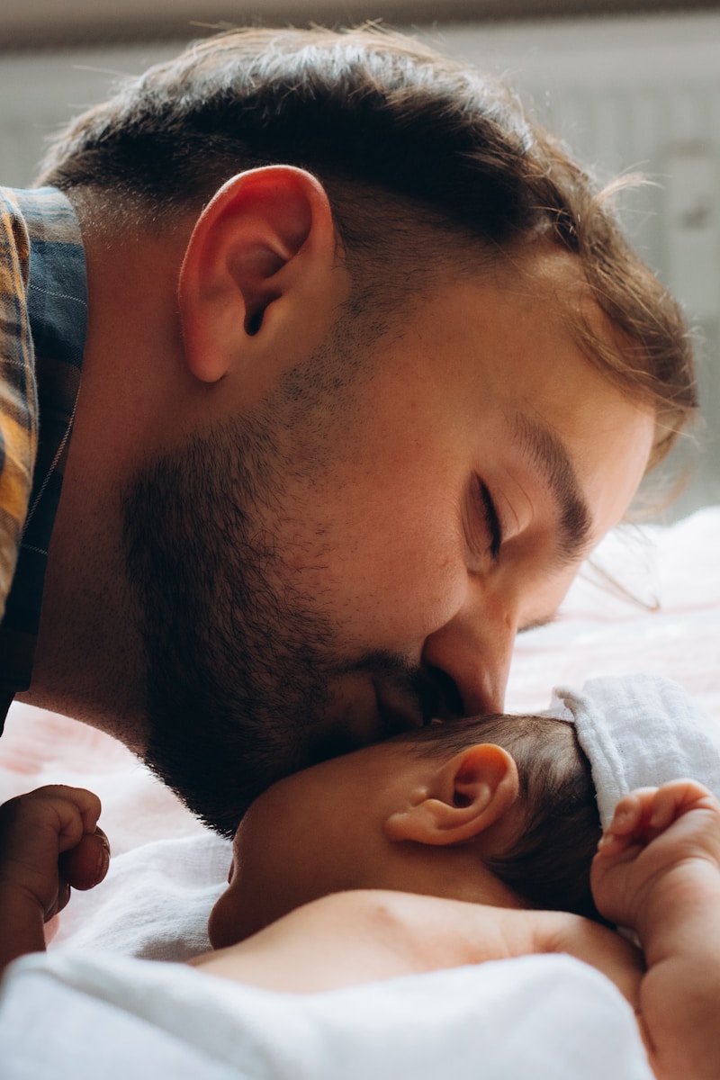 A parent caring for a newborn baby