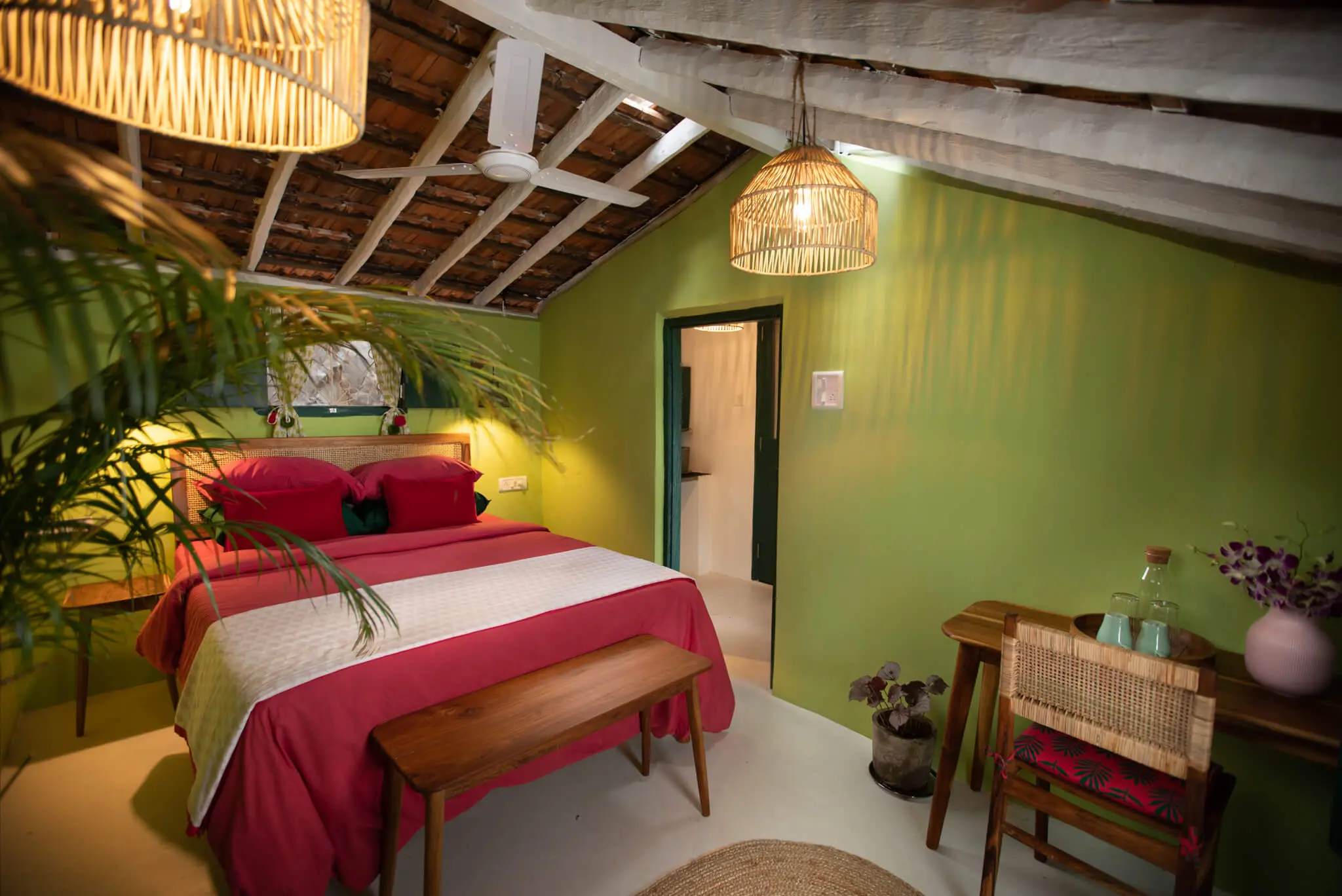 Sea View Room 4 at Casa Jaali — thatched ceiling and lime walls