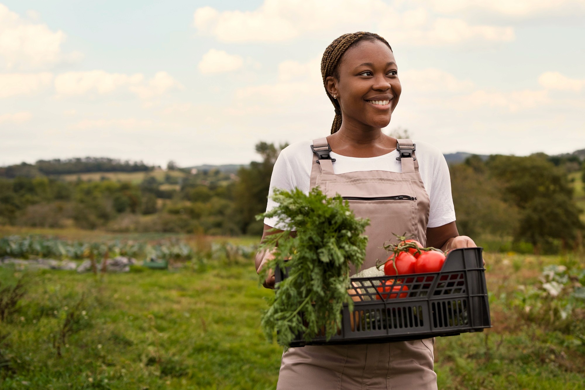 woman smiling with farm harvest