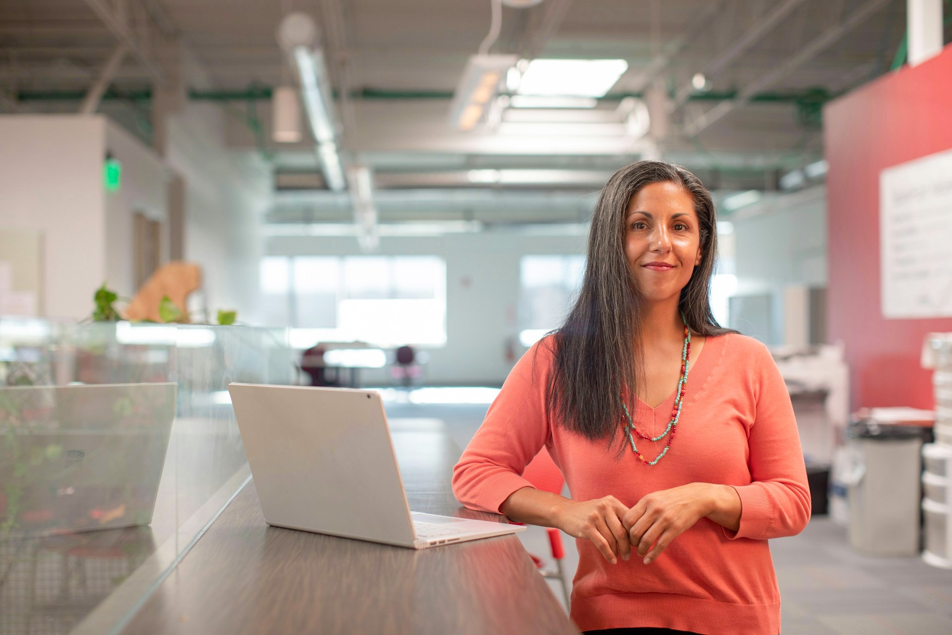 Woman with a laptop in the office.
