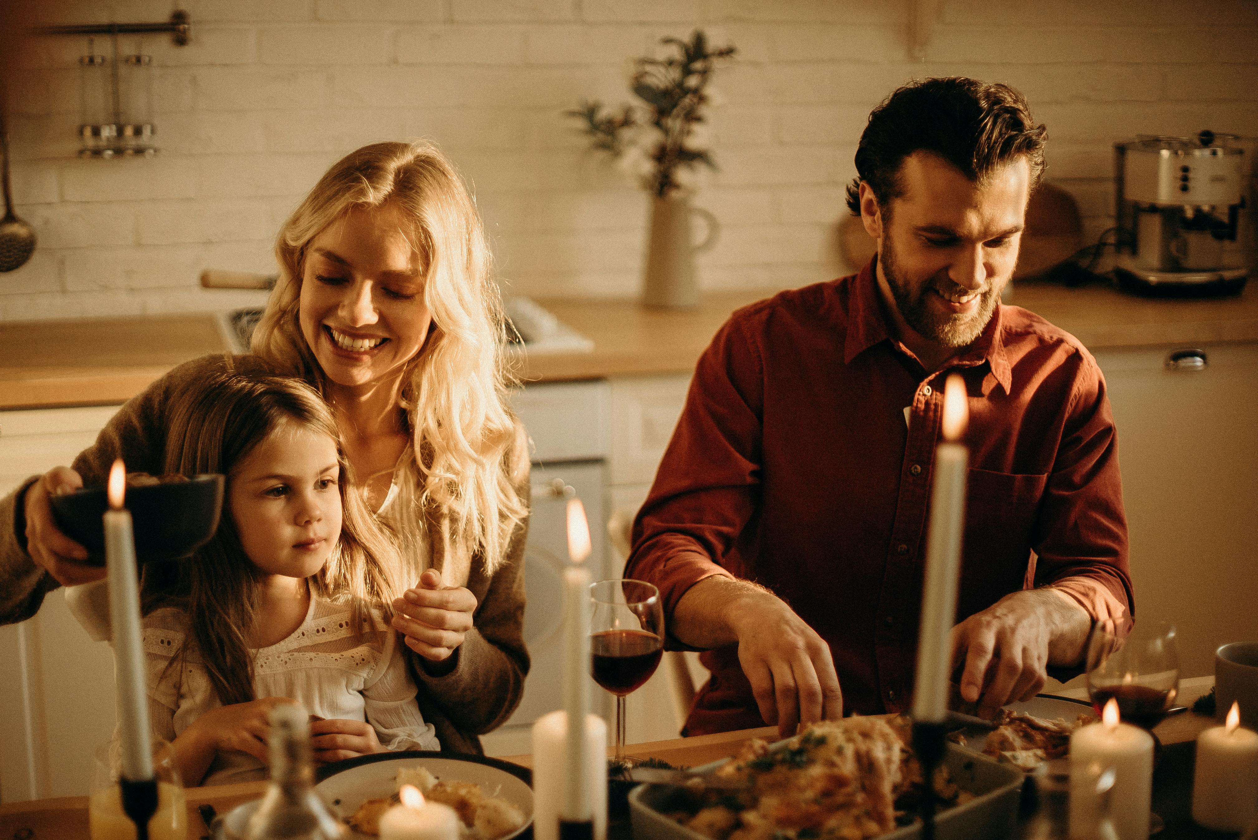 Conversion Truth for Families: Young mother, father, and daughter sit at a formal dinner table