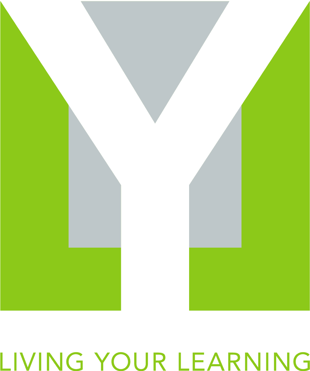 A close-up of a green and white sign with arrow arrows.