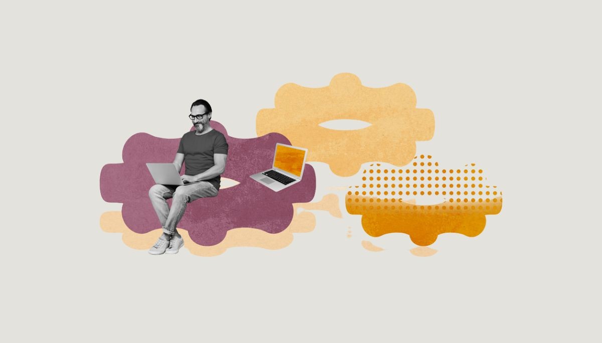 Person working on laptop with gears in background, symbolizing what a design engineer is and what they do.