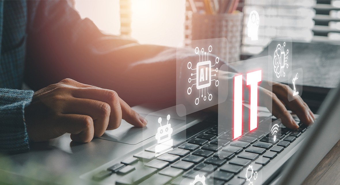 Person working with a laptop, IT technology with AI symbols in the foreground. Digitalisation, artificial intelligence.