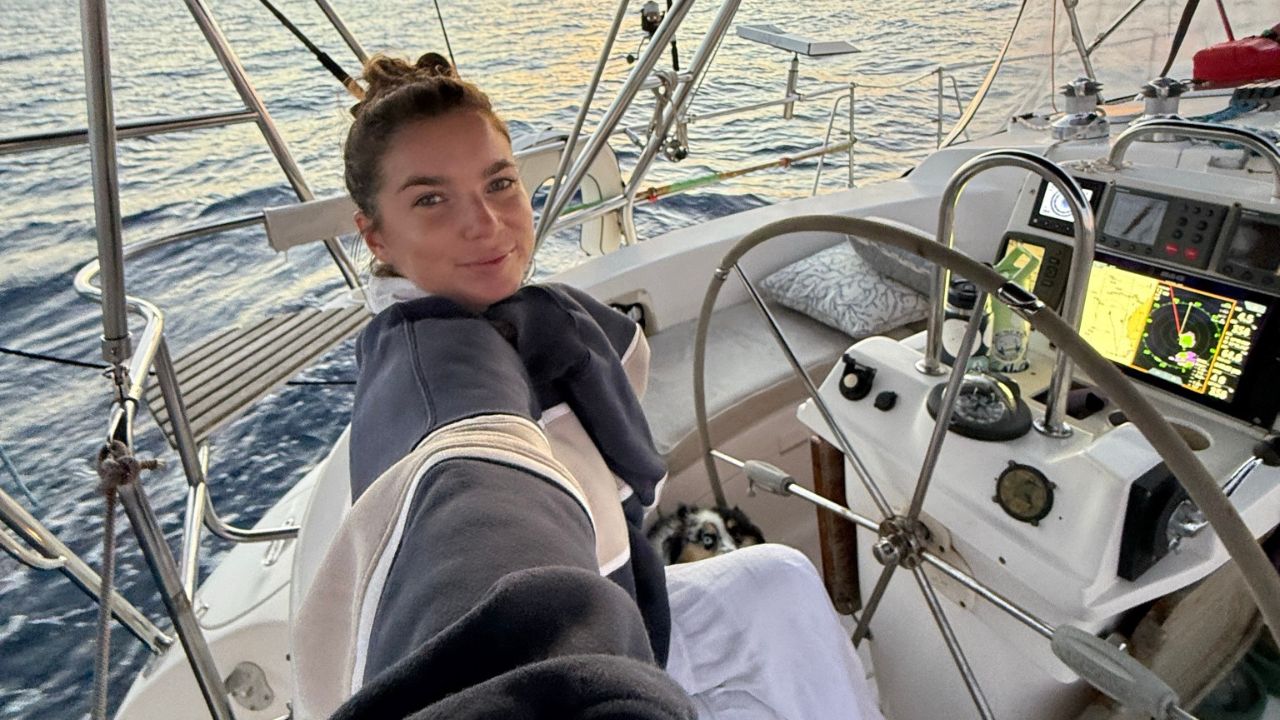 Emma from SailingAfterglow on her sailboat heading toward Dominica