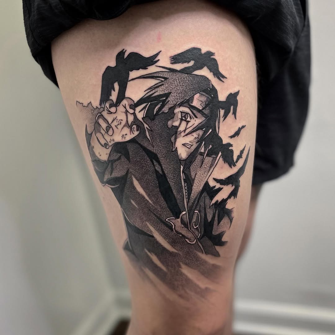 Black and gray tattoo of Itachi Uchiha dissolving into crows, symbolizing his genjutsu and mysterious presence.