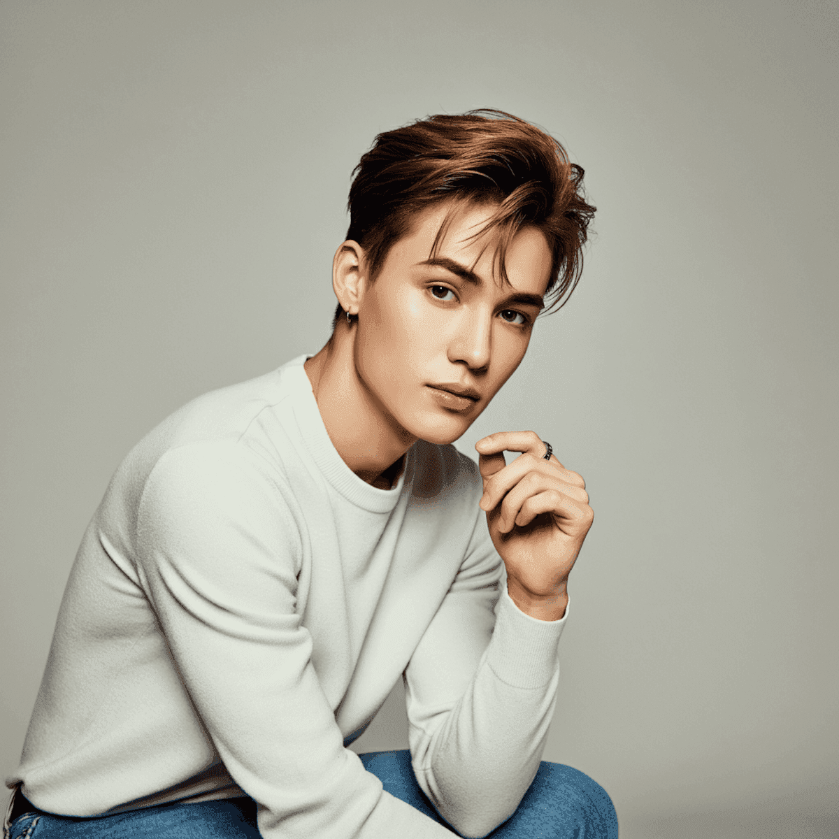 a man with a goatee smiles at the camera