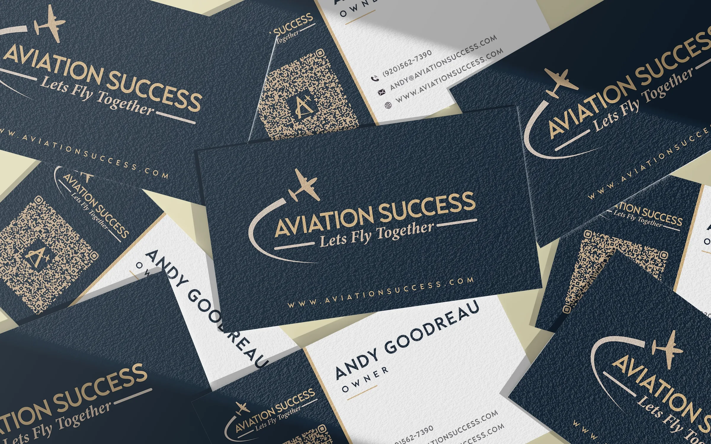 Premium navy blue and gold corporate business cards for Aviation Success founder Andy Goodreau, showcasing cohesive identity design.