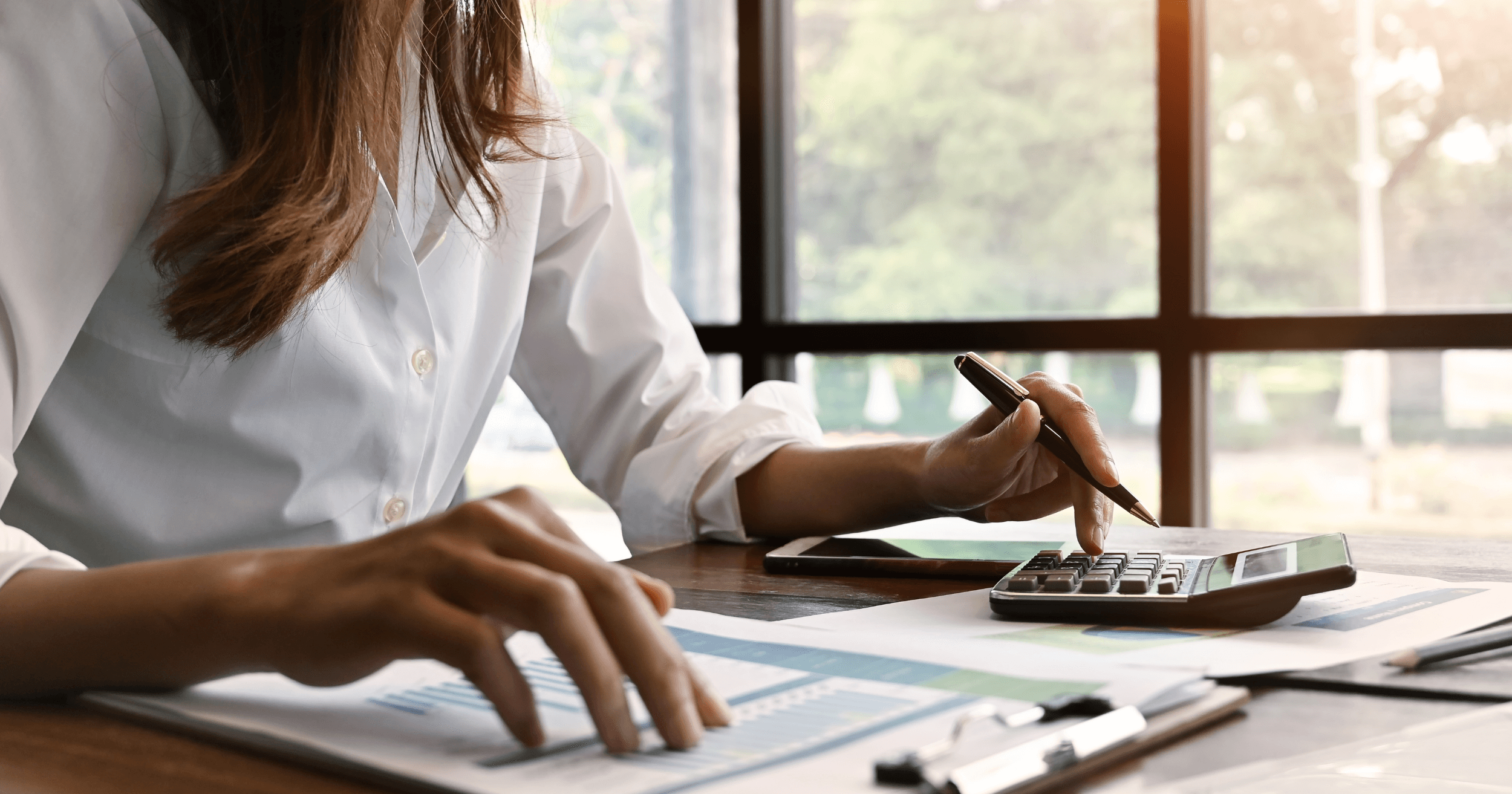 A Malaysian business owner working on finances
