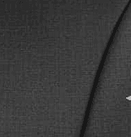 Man wearing round orange sunglasses and black jacket