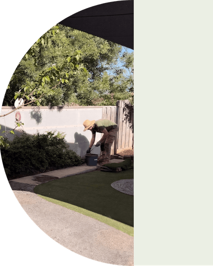gardener in garden picking up items
