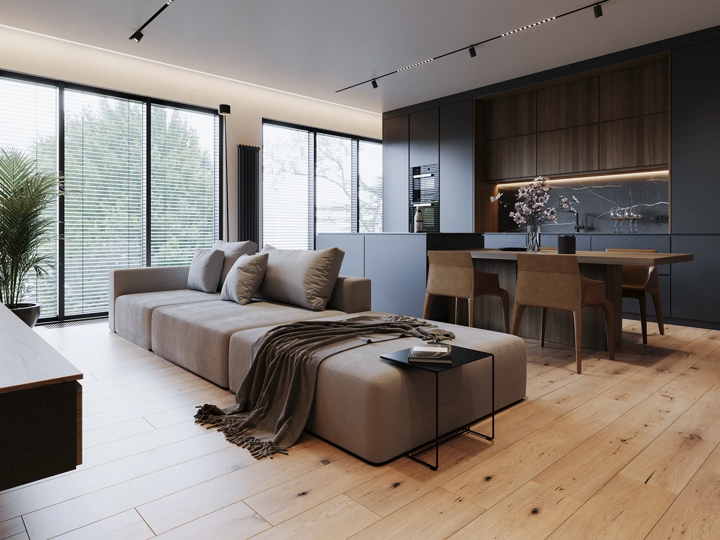 Salon-cuisine ouvert rénové au Luxembourg : canapé modulable, parquet chêne, cuisine encastrée gris mat, éclairage LED linéaire.