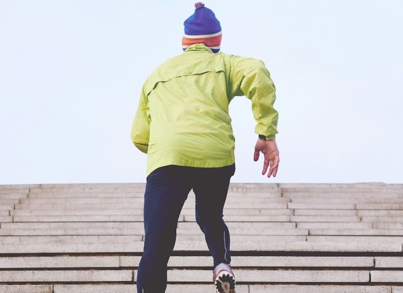 Individual confidently climbing steps, symbolizing Elementera’s mission to make AI adoption a straightforward path to growth for businesses