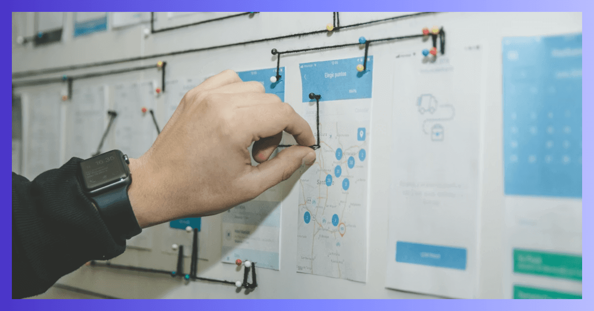 Hand holding a strategy on a whiteboard, project planning