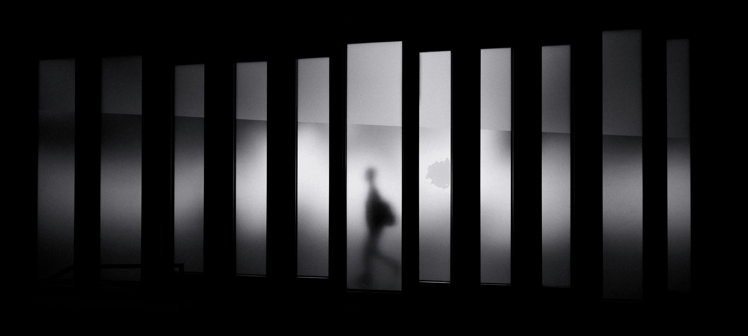 grayscale photo of person running in panel paintings