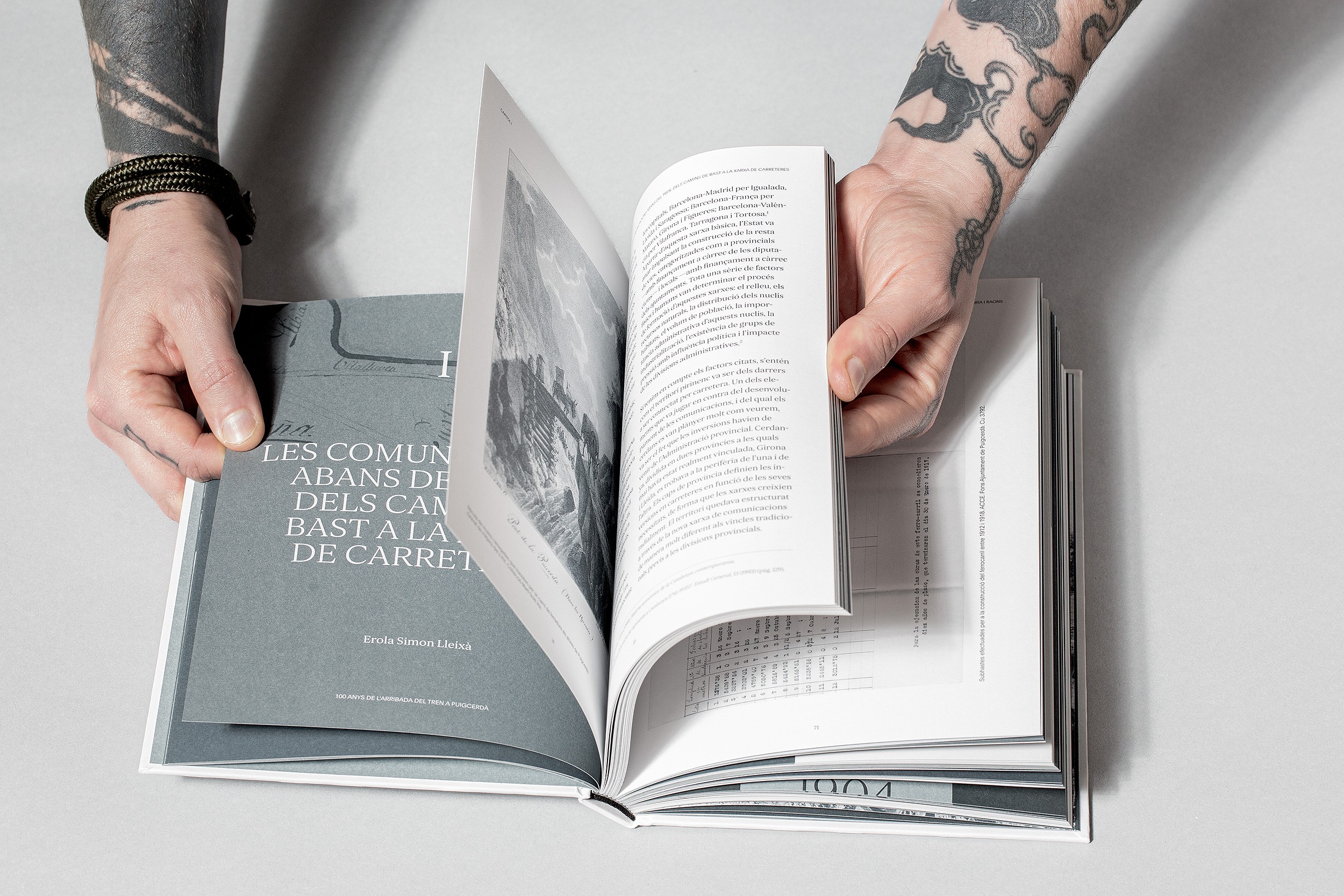 Minimalist book cover on white stairs with clean editorial design