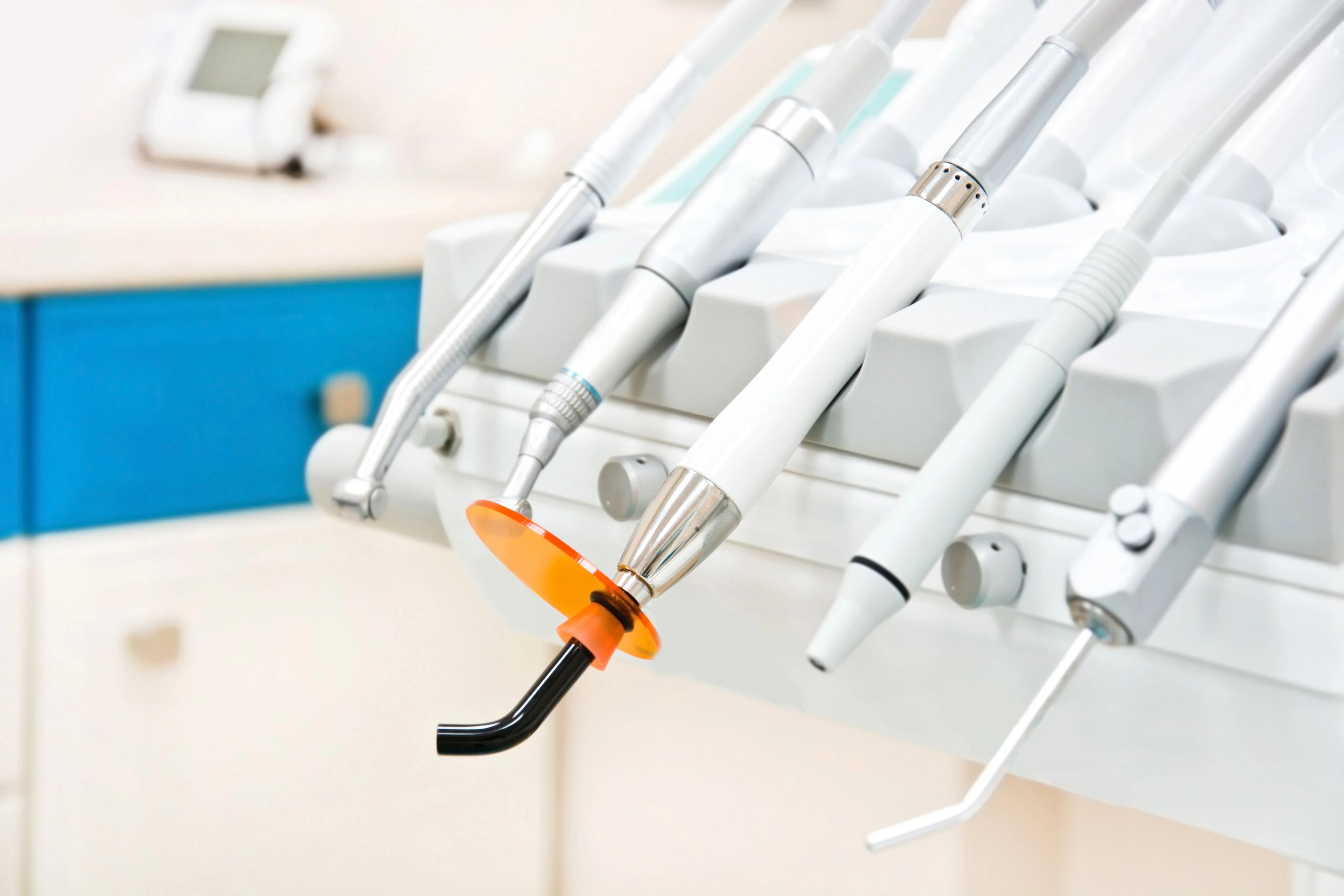 Close-up of dental tools and equipment arranged in a clinic setting