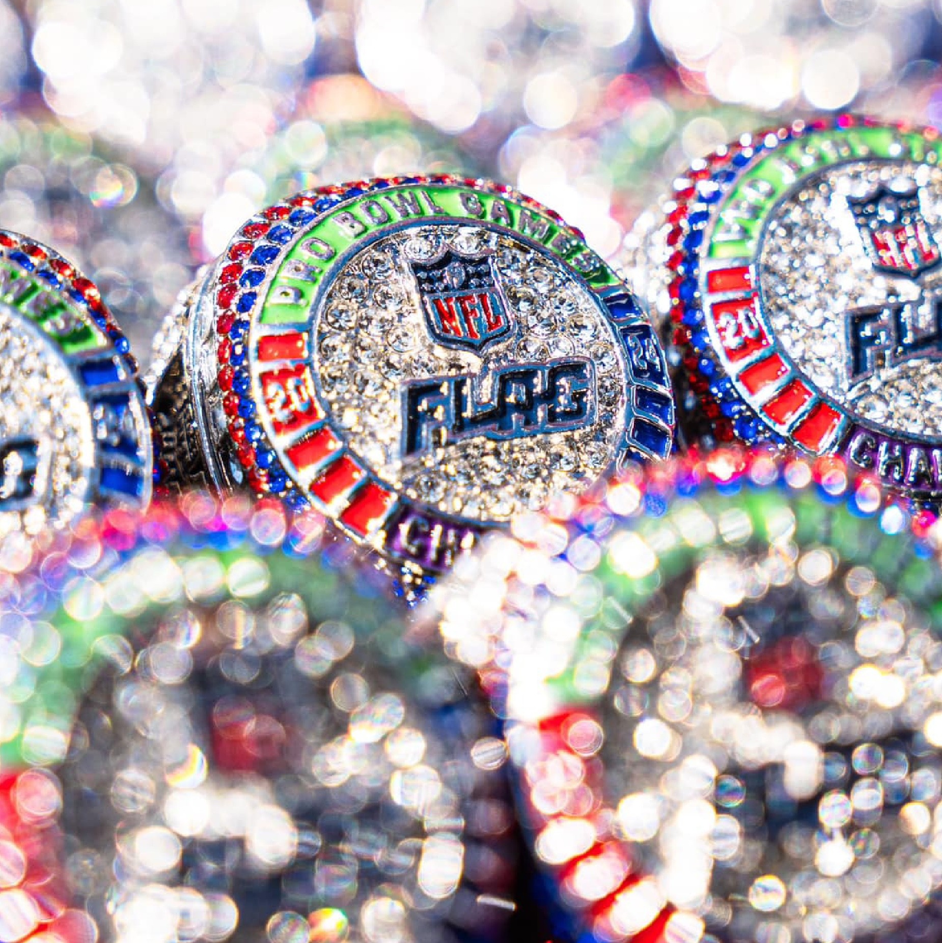 Stacked pink and red glass cosmetic jars on white—minimal skincare packaging display.