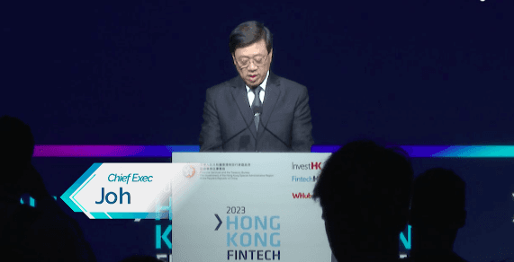 A field of pink flowers and trees