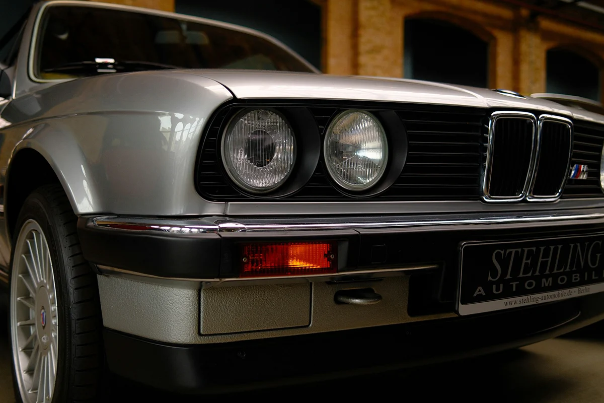 Cloudy headlight restoration showing a cleaner and brighter vehicle lighting surface.