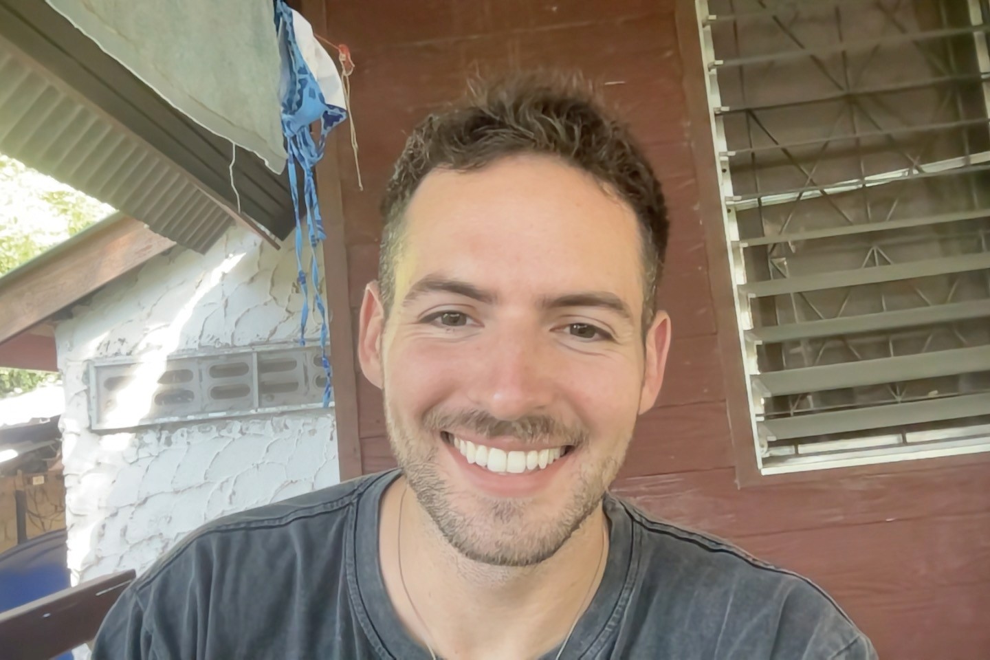 A man smiling into the camera