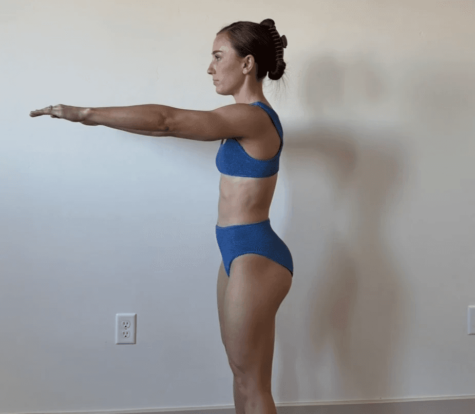 A person celebrating a fitness milestone in a gym environment, representing achievement tracking and workout success.