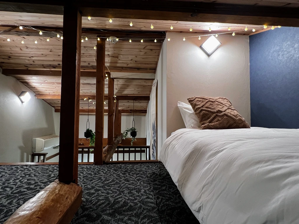 This room features a modern, Western-style layout with twin beds that can be configured as a king. Perfect for guests looking for comfort and flexibility.