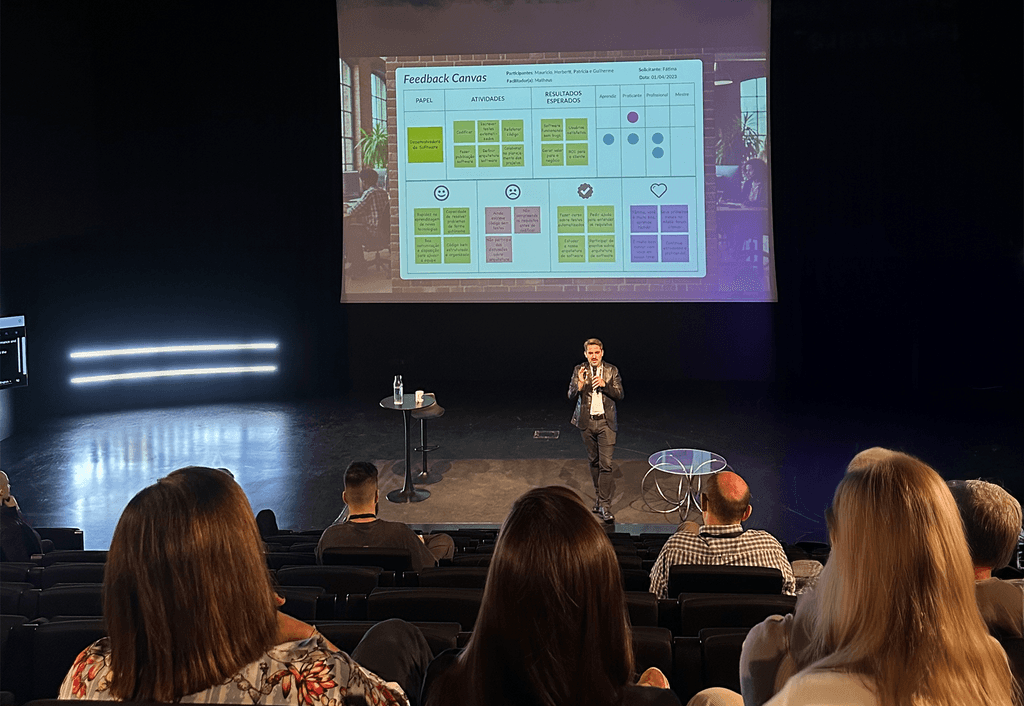 White man talking about Feedback Canvas on a convention